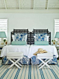 Headboards by Red Egg, perhaps. I love the black chinoiserie element. Ir really anchors this room.