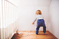 Toddler boy in a dangerous situation at home.