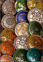 In the Marrakech souks, you could find these brightly painted circular plates for sale.