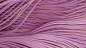 a close up of a purple fabric with wavy lines