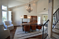 Mid-sized transitional medium tone wood floor great room photo in Los Angeles with white walls, a standard fireplace and a stone fireplace