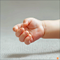 coloyou_Closeup_of_babys_hand_against_a_white_background_high_r_32215ff4-5f0f-49cf-a76a-a95b772a5d49
