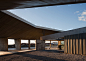Concrete canopy shelters bus station by Ismo Arquitectura : A cluster of concrete animal-feed silos loom over this bus station in Spain, designed by Ismo Arquitectura to improve transport links to a fortified town