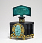 1920s Czechoslovakian perfume bottle, black crystal, malachite crystal stopper, jeweled gilt metalwork. Made in Czechoslovakia in lines.
 5 3/8 in.