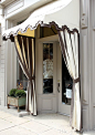 Cute store front. #curtains #awning #entry #storefront #store #shop #grey #topiary