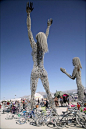 Sculpture framed by bicycles in Center Camp, the heart of Black Rock City