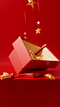 A christmas gift box with gold ribbon and golden stars on red background, in the style of leandro erlich, flora borsi, tim walker, photorealistic detail, studyblr, folded planes, polished metamorphosis