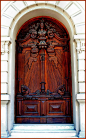 Heavily carved wooden door.