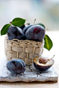 Gorgeously inky purple hued fresh plums. #food #fruit #plums #basket #summer: 