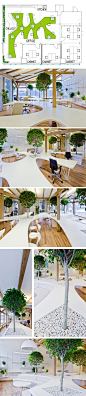Office Greenhouse by OpenAD_OpenAD created this contemporary office in 2012 for a company located in Riga, Latvia. The space features an open plan and an indoor forest of trees and potted plants.: 