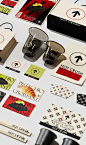 This may contain: various stickers and labels on a white surface with black cups, chopsticks, and paper