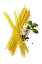 Italian Food: Spaghetti, Basil, Garlic and Peppercorns Isolated on White Background