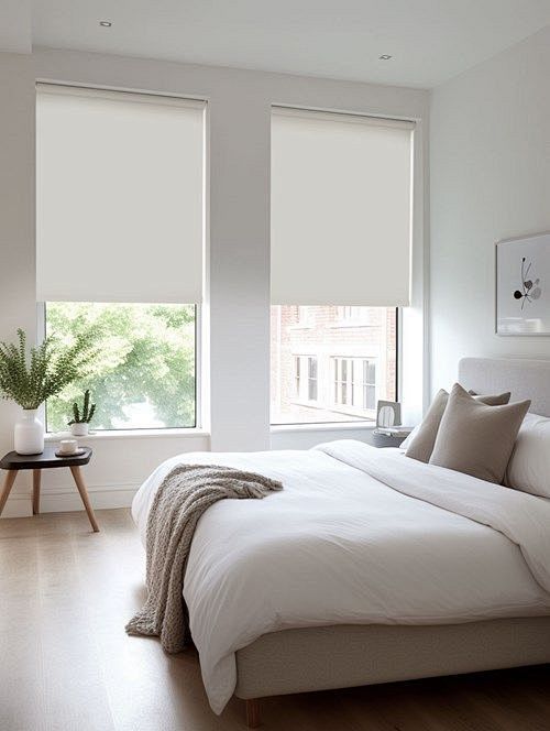 a white bed sitting ...