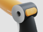 This may contain: an orange and black hair dryer sitting on top of a white table next to a yellow object