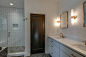 Bathroom - mid-sized transitional master white tile and subway tile slate floor and gray floor bathroom idea in Nashville with flat-panel cabinets, white cabinets, a two-piece toilet, white walls, an undermount sink, quartz countertops and a hinged shower