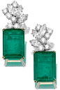 Pair of emerald and diamond ear clips. Each set with a detachable step-cut emerald weighing 35.53 and 36.03 carats respectively, suspended from a cluster surmount of marquise-shaped and brilliant-cut diamonds, mounted in gold. Sotheby's.