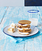 tack of smores on a white plate with glass of milk, studio shot by Radius Images on 500px