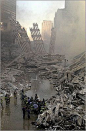 September 11, 2001 | Emergency personnel gathered at the site of the fallen World Trade Center.