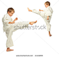 Karate boys kick by foot - stock photo