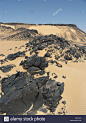 shiny-black-volcanic-rock-strewn-over-the-sand-in-the-black-desert-A9CYAC.jpg (975×1390)