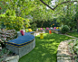 ESCAPE : An renovated garden retreat with modern and eclectic stylings set around a swimming pool and lush gardens.