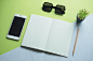 Free stock photo of sunglasses, smartphone, desk, notebook