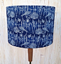 Sashiko Bird Navy Fabric covered lamp shade : Beautiful midnight blue with white etched birds,plants and seeds. The fabric covering this lamp shade is by Cloud9 fabrics .  The lampshades are all handmade by me (Anne) in Paisley Scotland. The size of this