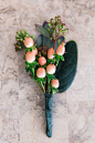 Coral berry boutonnière