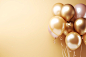 Gold balloons bunch on a pastel wall background. Horizontal banner