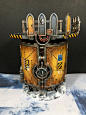 This may contain: a yellow and black model of a space station