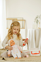 Girl Playing With Baby Doll