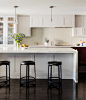 Example of a large transitional dark wood floor open concept kitchen design in Boston with a single-bowl sink, shaker cabinets, white cabinets, marble countertops, white backsplash, glass tile backsplash, paneled appliances and an island