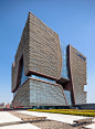 Curvy holes puncture the walls of this university building completed by architecture firm Aedas in Suzhou, China