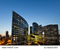 Night architecture - skyscrapers with glass facade. Modern buildings in Paris business district. Evening dynamic traffic on a street. Concept of economics, financial.  Copy space for text. Toned