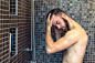 Young man washing his hair in the shower by Lars Zahner on 500px