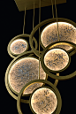 Antique gold and decorated resin characterize the Moon Lighting collection, simple and essential lamps but at the same time rich in atmosphere, real sculptures diffusing a warm light into the ambient