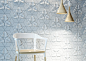 Room with chair and floral motifs Soft and Organic Design: Textural Concrete Tiles with Flowery Motifs