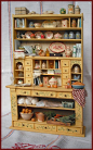 Kitchen hutch filled with miniature goodies. What a treasure hunt!