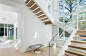 Large minimalist wooden u-shaped open staircase photo in Boston