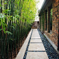 Design ideas for a mid-sized modern partial sun side yard concrete paver walkway in Houston for spring.