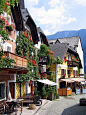 Hallstat town centre, Austria- I libe how the building hsve little balconies snd flowers all over.: 