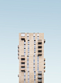 beige concrete high-rise building