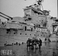 US ship docked at Shanghai. An UK sailor was wounded by the Communists.   停在黄浦江码头，从长江撤回来的英国军舰和被炮击受伤的英国军舰与水兵