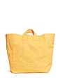 Stella McCartney | Two-way logo cotton canvas beach tote | Women | Lane Crawford - Shop Designer Brands Online : Enveloped in a bright yellow hue, this chic two-way beach tote by Stella McCartney is expertly crafted in sturdy cotton canvas. Upholding the 