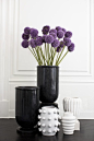 kelly wearstler. black and white graphic vases with purple flowers