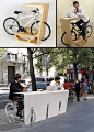 Street furniture. Now if only it lifted the rear wheel so you could pedal while you sit if you wanted.: 