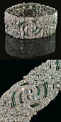 Beautiful and rare diamond and emerald open-work strap bracelet of repeating floral and foliate-scroll design Auger Frères, Paris circa 1930@北坤人素材