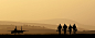 Silhouette of military attack aircraft against vibrant sunset sk