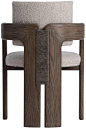 This may contain: the back side of a wooden chair with an upholstered seat and armrest