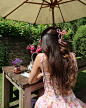 Photo shared by Amber Rose Peake on June 28, 2024 tagging @houseofcb, @ajouterstore, and @rhode. May be an image of 1 person, parasol, sundress and umbrella.